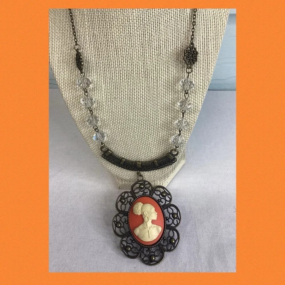 Orange and bronze cameo necklace.